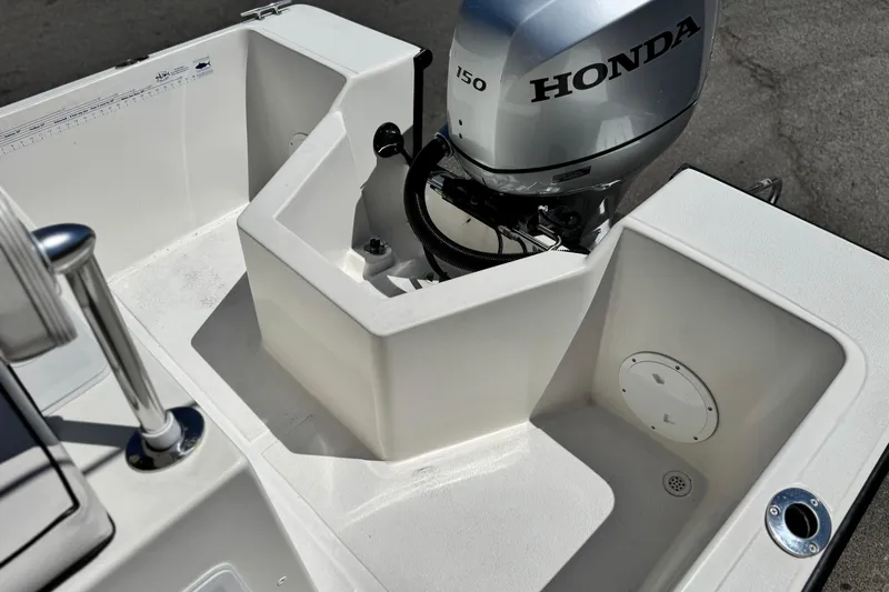 Slide: The Image of 2019 Thresher 19 CC boat with Honda 150 outboard motor, white interior. - 16