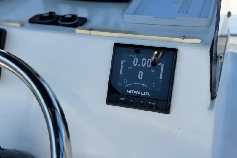 Slide: The Image of Dashboard of 2019 Thresher 19 CC boat with Honda display and steering wheel. - 22