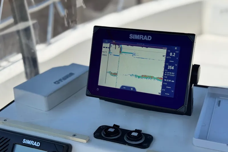 Slide: The Image of Simrad navigation display on 2019 Thresher 19 CC boat dashboard. - 23