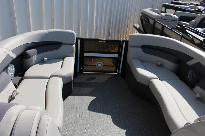 Slide: The Image of 2025 Barletta Cabrio 22CC boat interior with gray seating and spacious layout. - 11
