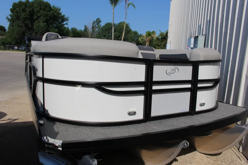 Slide: The Image of 2025 Barletta Cabrio 22CC pontoon boat, white exterior, parked outdoors. - 2