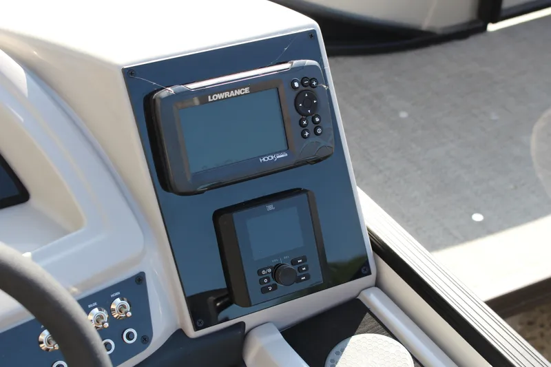 Slide: The Image of 2025 Barletta Cabrio 22CC dashboard with Lowrance and JBL displays. - 7