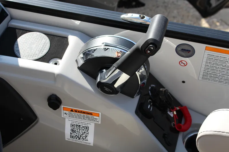 Slide: The Image of Control panel of 2025 Barletta Cabrio 22CC boat with throttle and warning labels. - 8