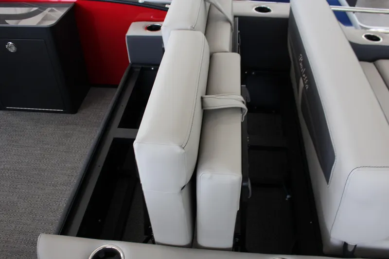 Slide: The Image of 2025 Barletta Cabrio 24UE boat interior with gray seating and cup holders. - 14