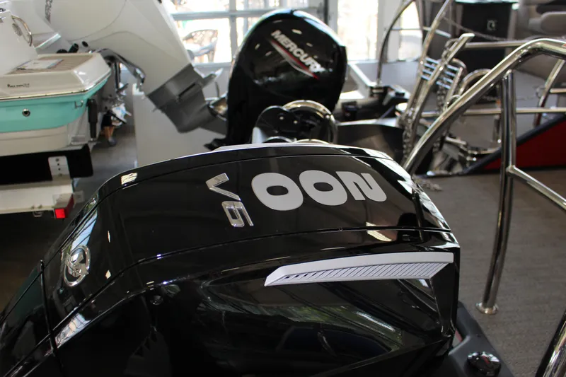 Slide: The Image of 2025 Barletta Cabrio 24UE with powerful V6 outboard motor in showroom. - 15