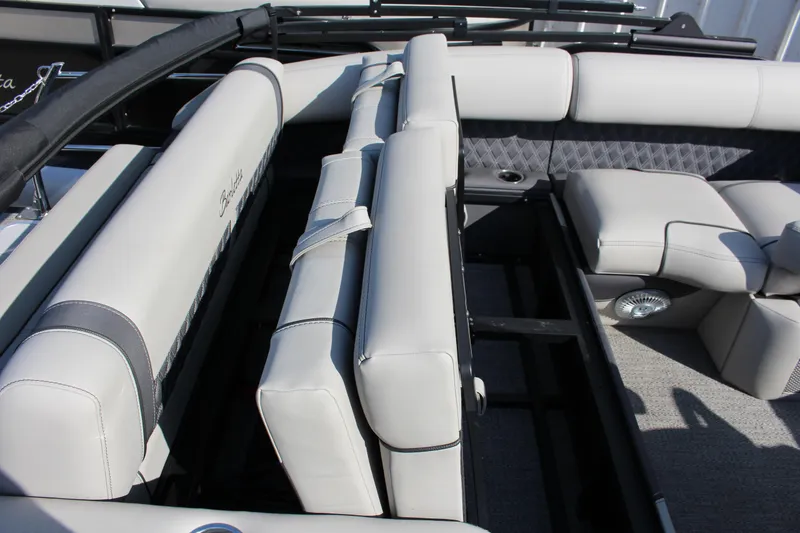 Slide: The Image of 2025 Barletta Lusso 23U boat interior with luxurious seating and storage compartments. - 9