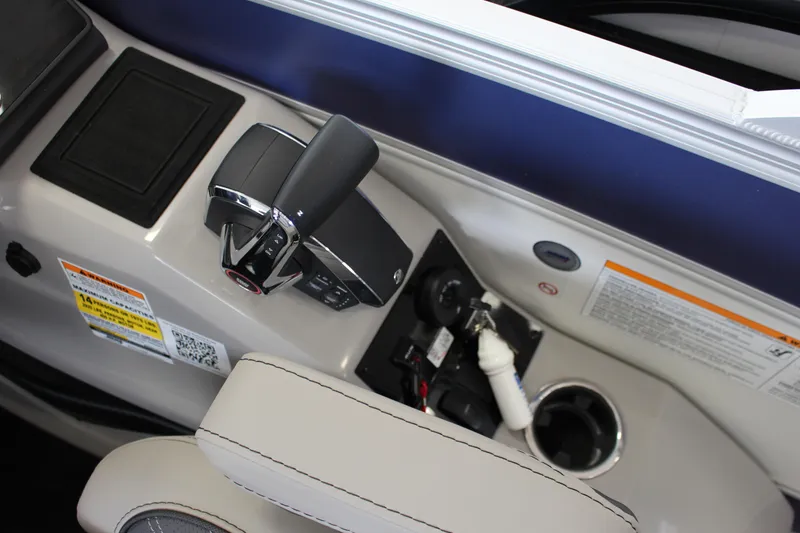 Slide: The Image of Control panel of 2025 Barletta LUSSO 25U boat with throttle and cup holder. - 13