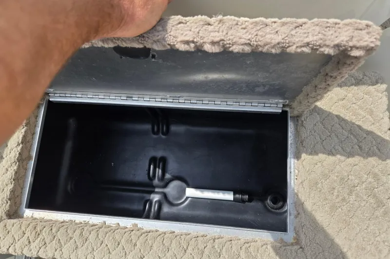 Slide: The Image of Open storage compartment in 2007 Suncruiser Trinidad 204 boat, showing interior details. - 14