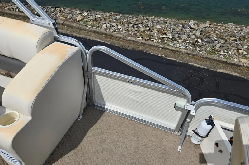 Slide: The Image of Interior of 2007 Suncruiser Trinidad 204 boat with seating and safety equipment. - 15