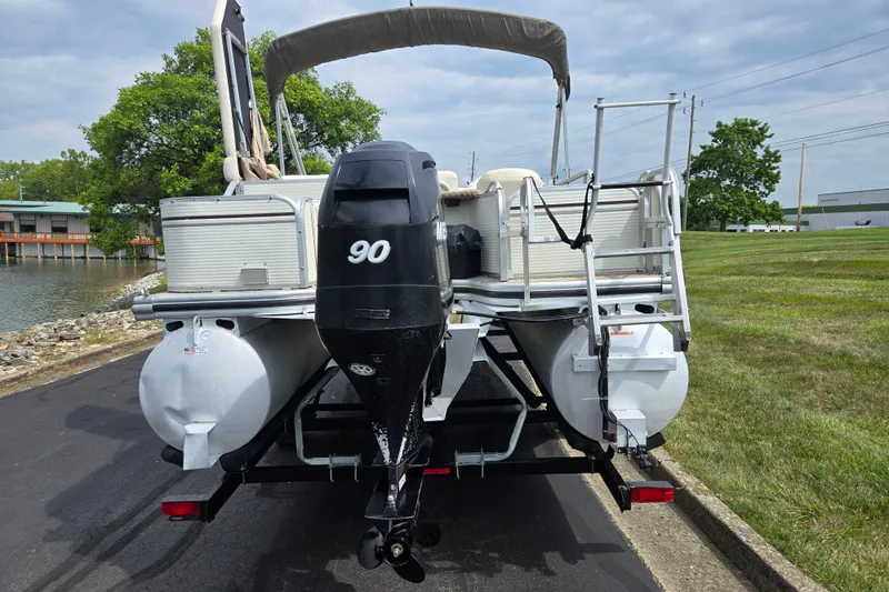 Slide: The Image of 2007 Suncruiser Trinidad 204 pontoon boat with 90 HP motor on trailer. - 2