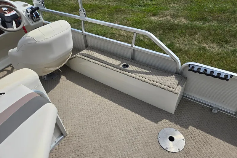 Slide: The Image of Interior of 2007 Suncruiser Trinidad 204 boat with seating and steering wheel. - 21