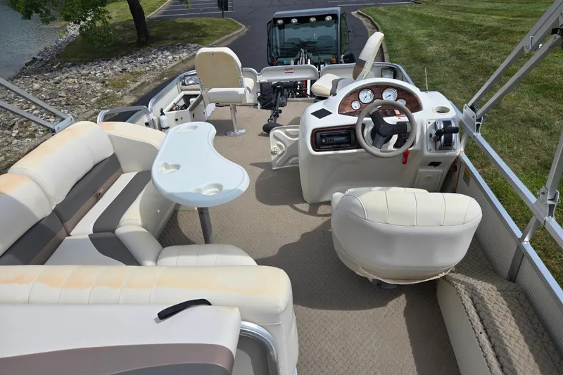Slide: The Image of Interior of 2007 Suncruiser Trinidad 204 pontoon boat with seating and steering console. - 23