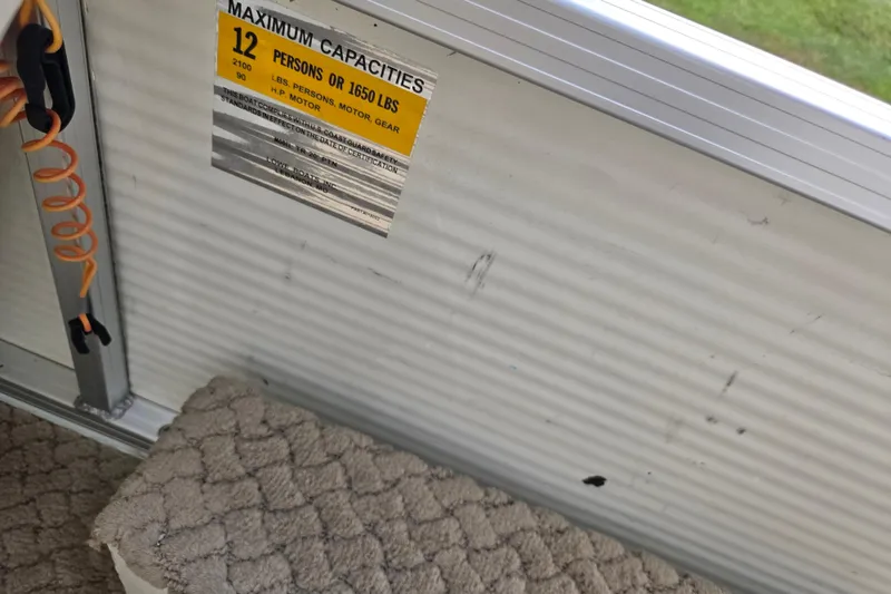 Slide: The Image of 2007 Suncruiser Trinidad 204 capacity label, 12 persons or 1650 lbs, interior view. - 25