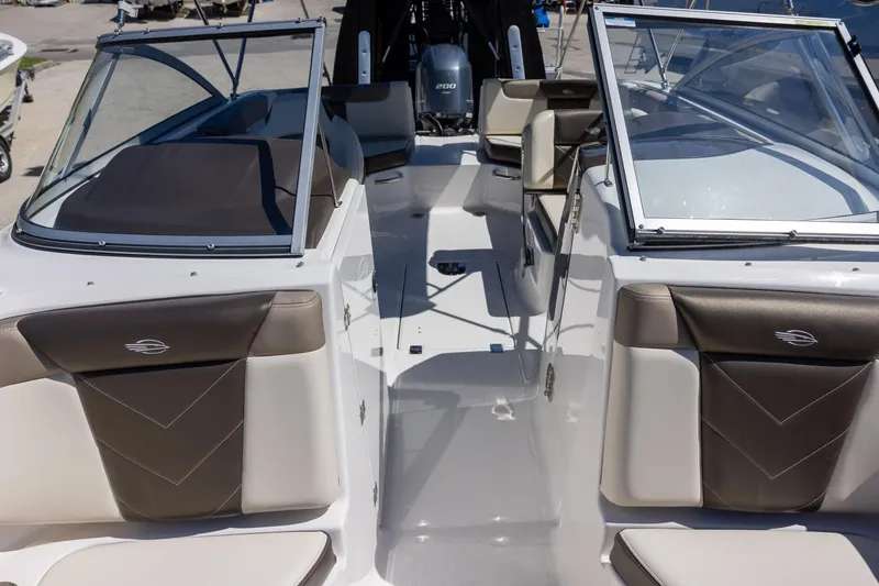 Slide: The Image of 2019 Chaparral 230 Suncoast boat interior with open windshield and seating. - 16