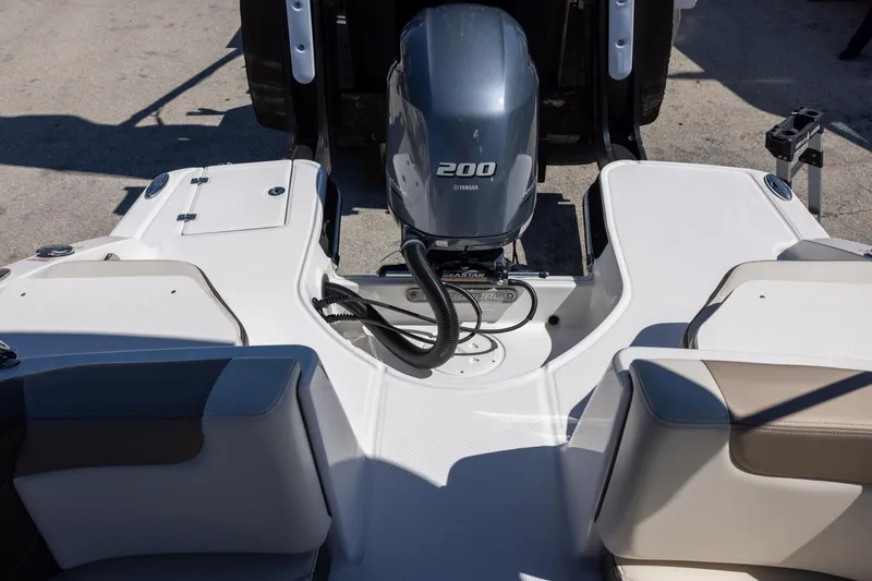 Slide: The Image of 2019 Chaparral 230 Suncoast boat with Yamaha 200 engine, rear seating view. - 17