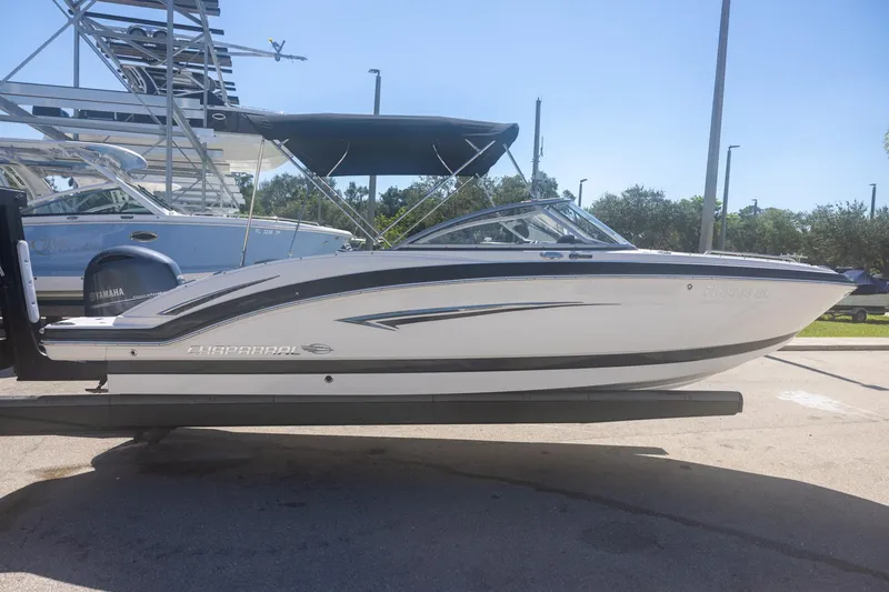 Slide: The Image of 2019 Chaparral 230 Suncoast boat on trailer, side view, sunny day. - 2