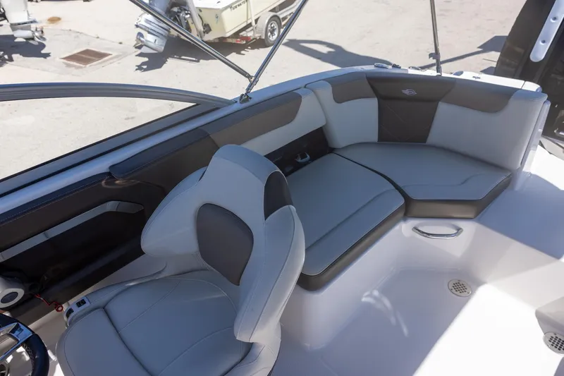 Slide: The Image of 2019 Chaparral 230 Suncoast boat interior with gray seating and modern design. - 8