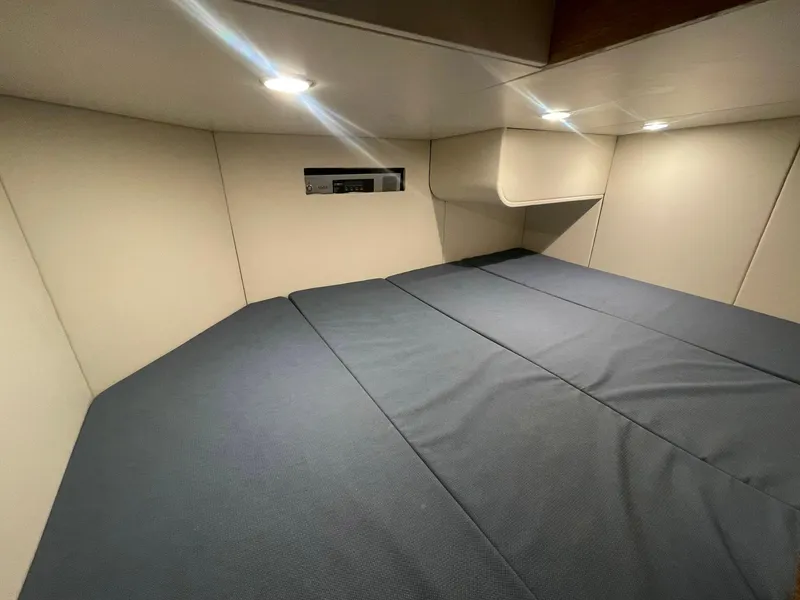 Slide: The Image of 2020 Scout 530 LXF cabin interior with modern lighting and comfortable bedding. - 15