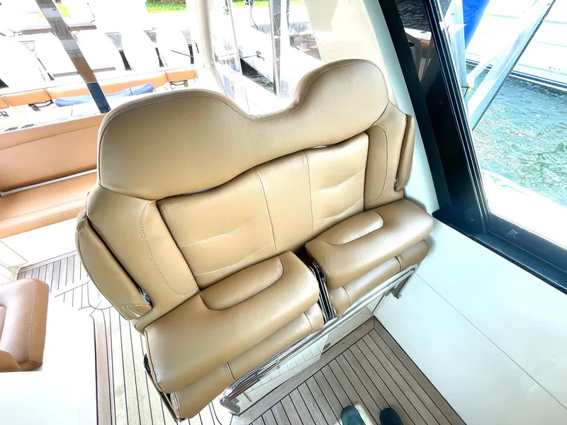 Slide: The Image of Luxurious tan seating on 2020 Scout 530 LXF boat, featuring elegant design and comfort. - 17