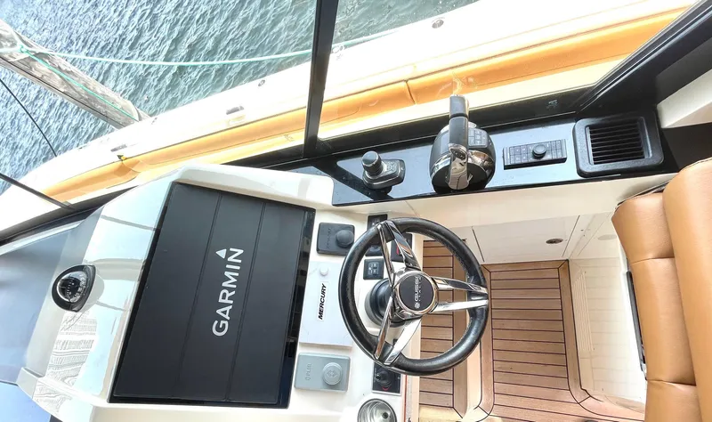 Slide: The Image of 2020 Scout 530 LXF helm with Garmin display and luxurious seating. - 19