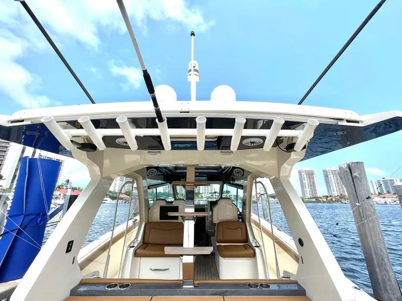 Slide: The Image of 2020 Scout 530 LXF luxury boat interior with city skyline in background. - 25