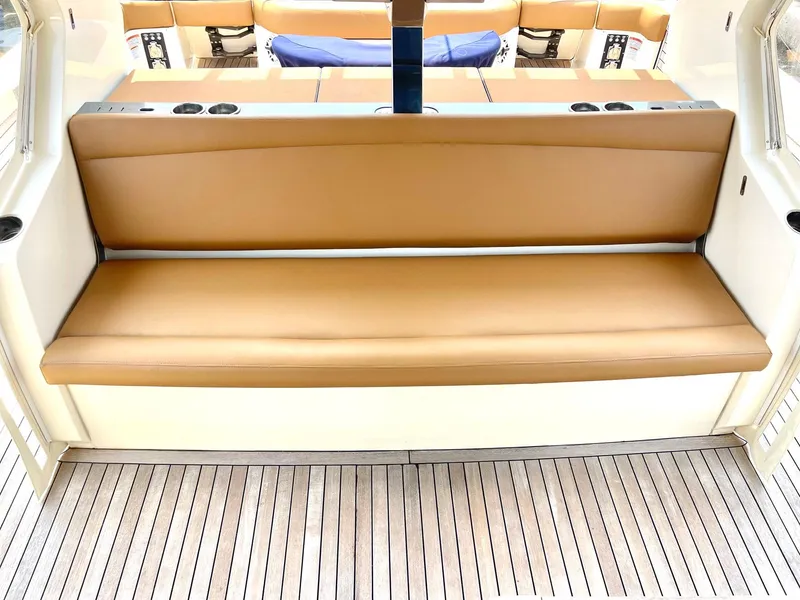 Slide: The Image of Luxurious seating on 2020 Scout 530 LXF boat with teak flooring. - 27