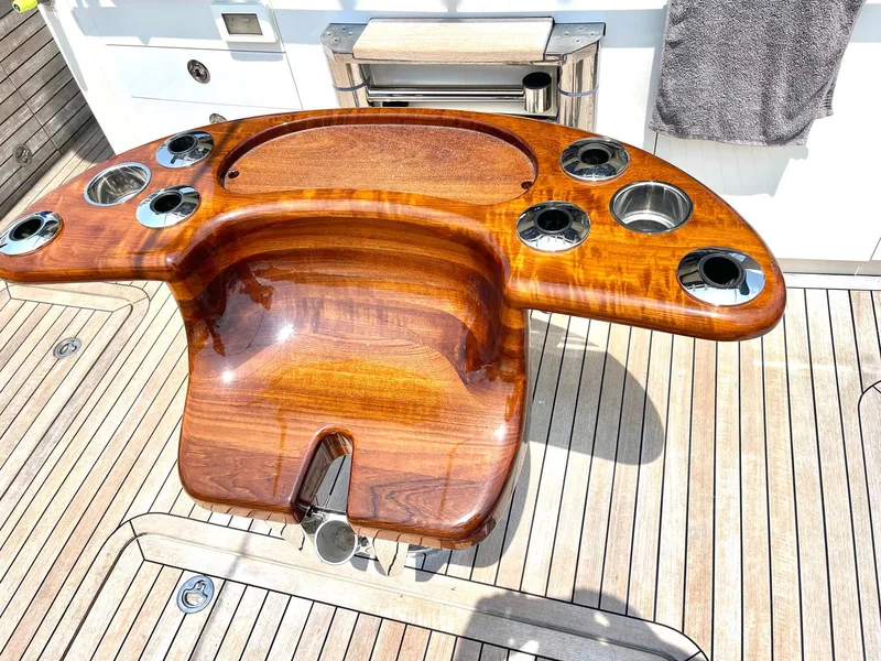 Slide: The Image of Luxurious wooden helm station on 2020 Scout 530 LXF yacht deck. - 28
