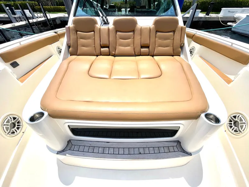 Slide: The Image of Luxurious seating on 2020 Scout 530 LXF boat, featuring tan leather upholstery. - 4