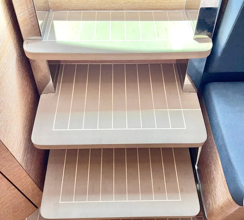 Slide: The Image of Wooden steps on a 2020 Scout 530 LXF boat interior. - 8