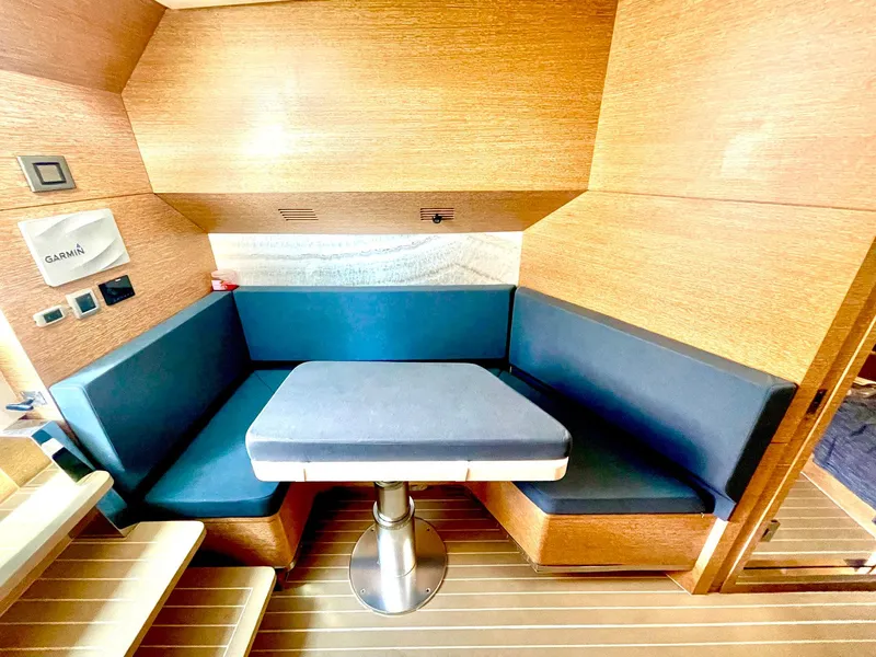 Slide: The Image of 2020 Scout 530 LXF interior with blue seating and wooden accents. - 9