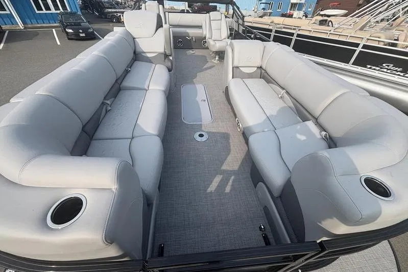 Slide: The Image of 2025 Regency 250 DL3 pontoon boat with spacious seating and modern design. - 6