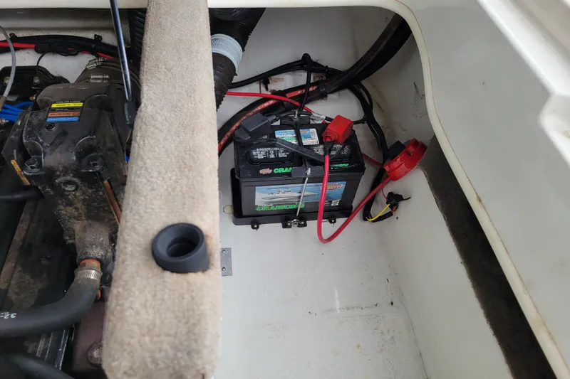 Slide: The Image of Interior of a 2006 Sea Ray 205 Sport boat with yellow and white seating. - 12