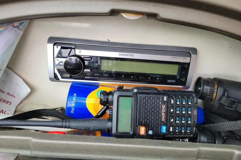 Slide: The Image of Kenwood stereo and Baofeng radio in 2006 Sea Ray 205 Sport boat console. - 18