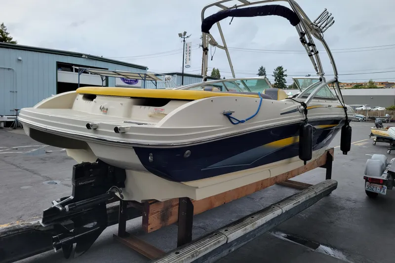 Slide: The Image of 2006 Sea Ray 205 Sport boat docked at marina, sunny day. - 3