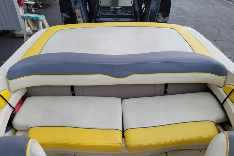 Slide: The Image of 2006 Sea Ray 205 Sport boat on a wooden stand in a storage facility. - 7