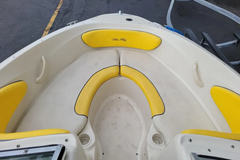 Slide: The Image of 2006 Sea Ray 205 Sport boat on trailer, parked in a marina lot. - 9