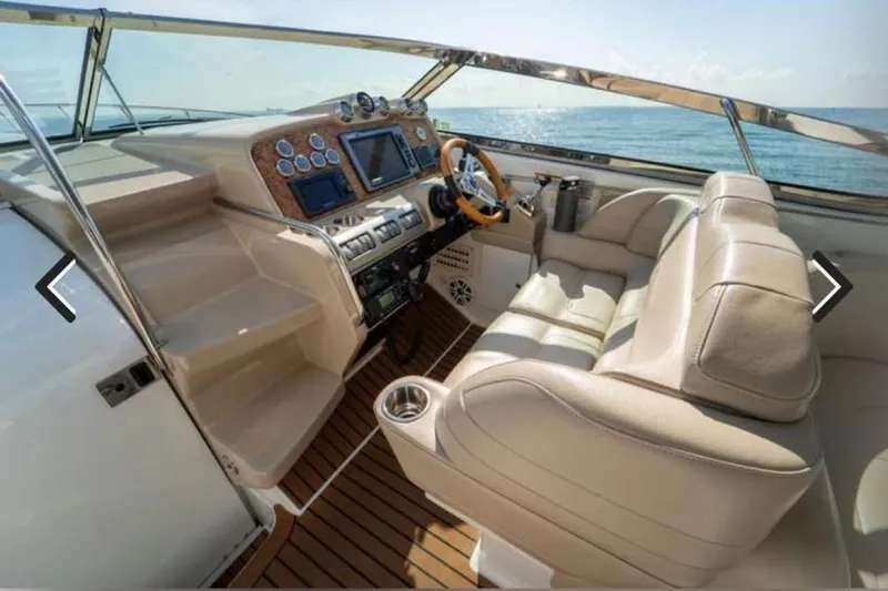 Slide: The Image of 2011 Formula 400 Super Sport yacht cockpit with luxurious seating and modern controls. - 10