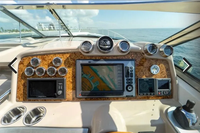 Slide: The Image of Dashboard of 2011 Formula 400 Super Sport boat with navigation and control instruments. - 11