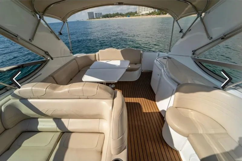 Slide: The Image of Luxurious 2011 Formula 400 Super Sport yacht interior with beige seating and ocean view. - 14