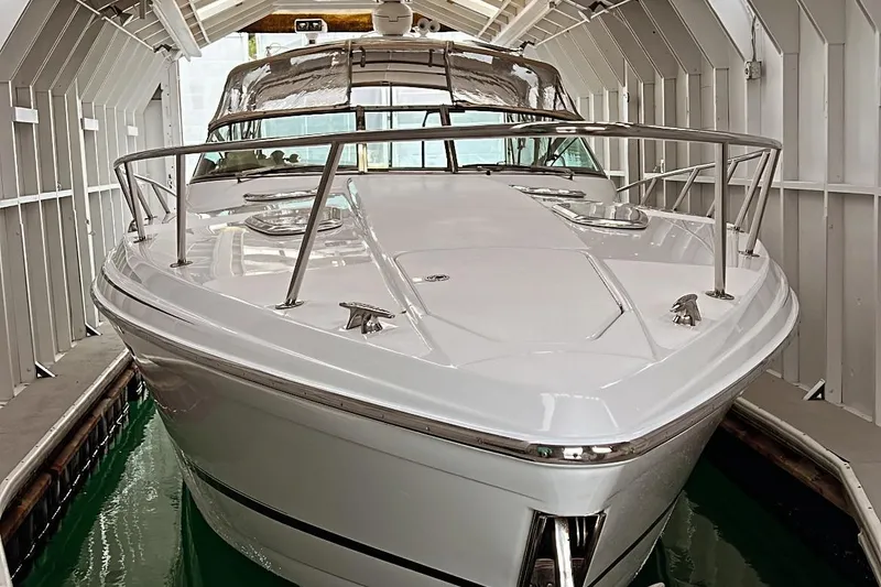 Slide: The Image of 2011 Formula 400 Super Sport boat docked in a covered marina. - 4