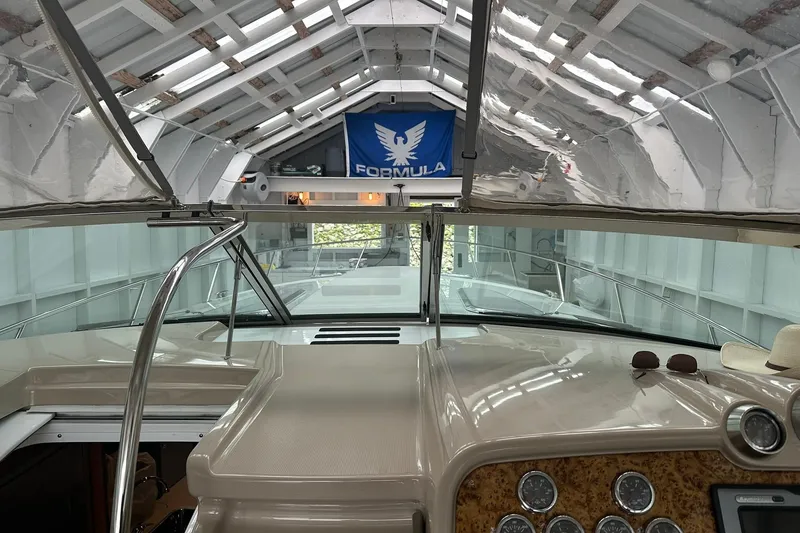 Slide: The Image of Interior view of a 2011 Formula 400 Super Sport boat in a covered dock. - 7