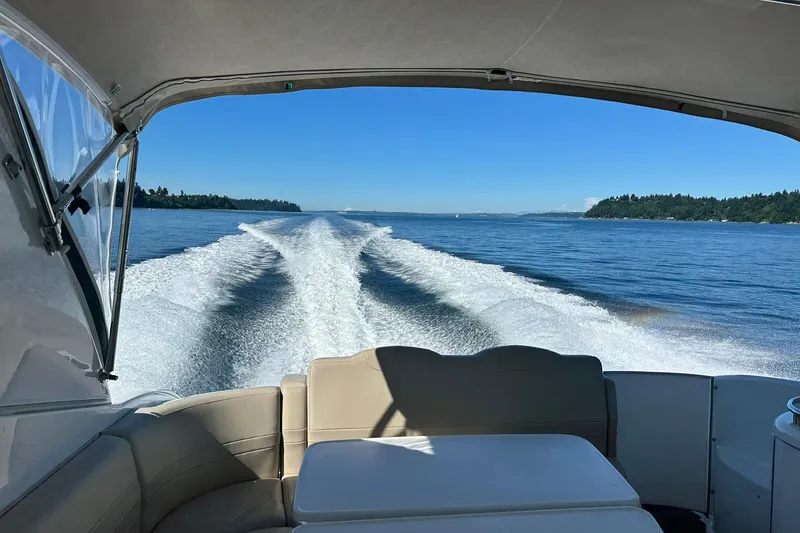 Slide: The Image of 2011 Formula 400 Super Sport boat cruising on a clear blue lake. - 8