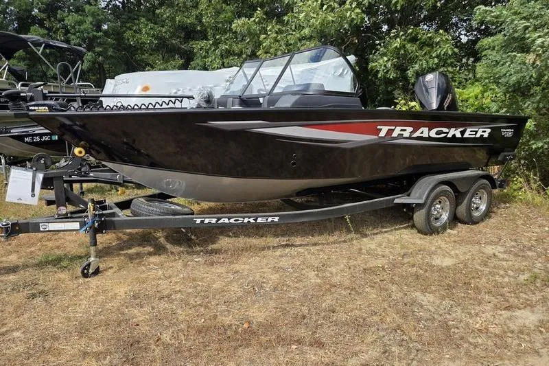 The Image of 2026 Tracker Targa™ V-19 WT boat on trailer, parked outdoors. - 2