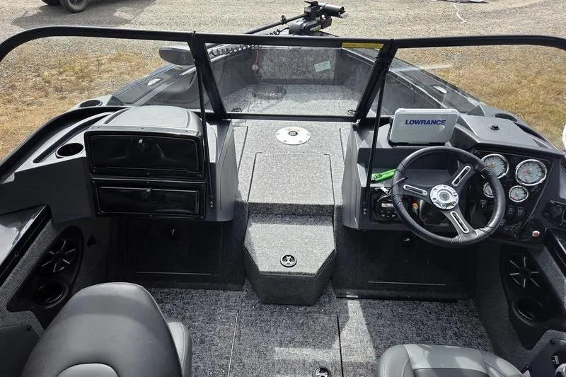 Slide: The Image of 2026 Tracker Targa™ V-19 WT boat interior with steering wheel and dashboard controls. - 7