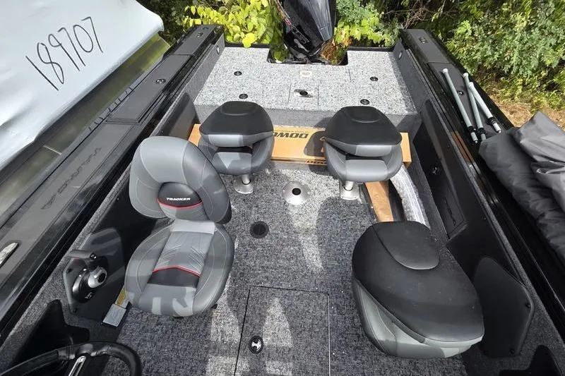 Slide: The Image of 2026 Tracker Targa™ V-19 WT boat interior with seating and storage compartments. - 8
