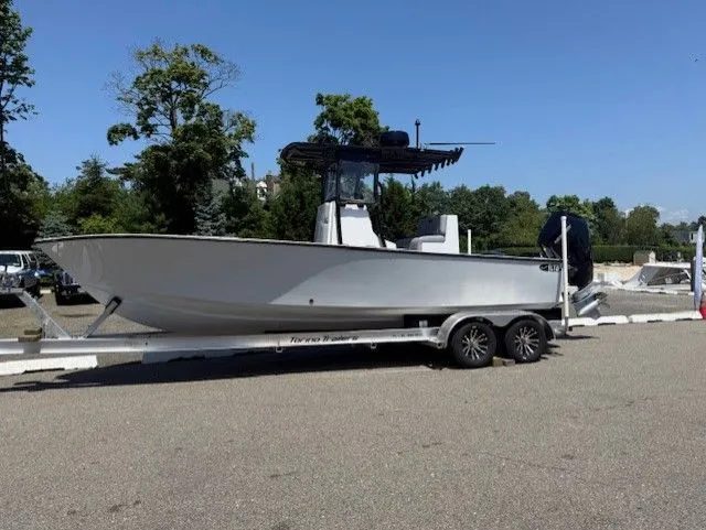 The Image of 2025 Latitude Tournament Boats 25 on trailer, parked outdoors, side view. - 0