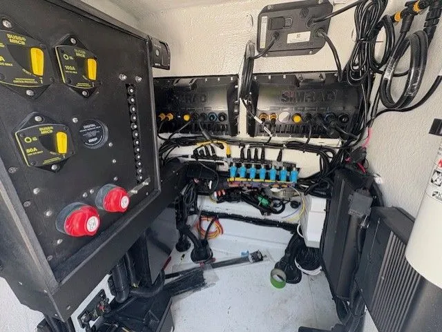 Slide: The Image of Electrical system inside a 2025 Latitude Tournament Boats 25, featuring wiring and control panels. - 15
