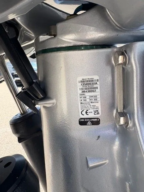 Slide: The Image of Close-up of a 2025 Latitude Tournament Boats 25 engine component with identification label. - 16