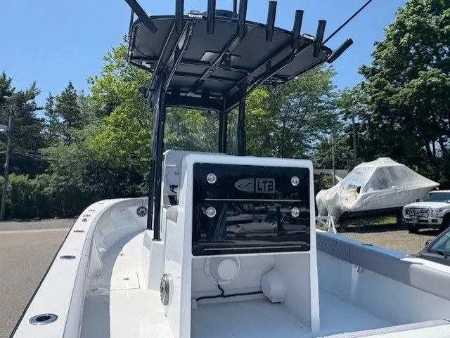 Slide: The Image of 2025 Latitude Tournament Boats 25, sleek design, center console, outdoor setting, clear blue sky. - 5