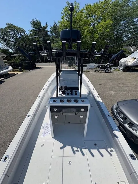 Slide: The Image of 2025 Latitude Tournament Boats 25 model, sleek design, spacious deck, parked outdoors. - 7